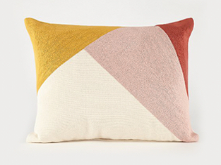 Geometric cushion in pink, cream, mustard and burnt orange