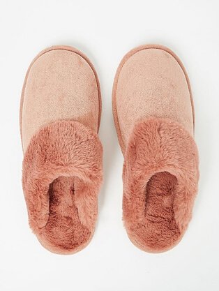 Pink slippers with faux fur trim.