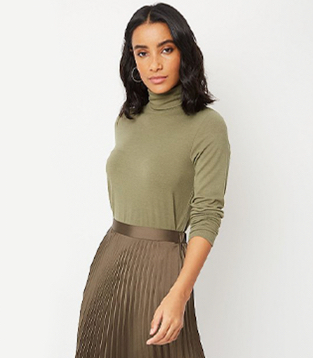 Woman wearing a khaki top and matching skirt