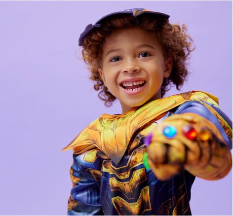 A boy posing in a Thanos costume