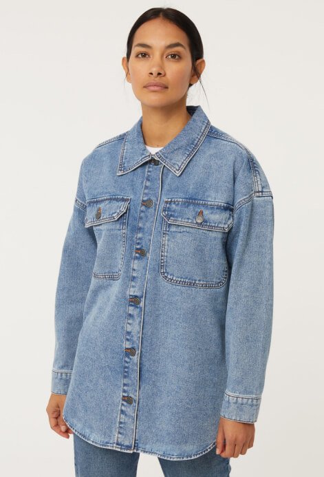 A woman wearing a denim jacket.