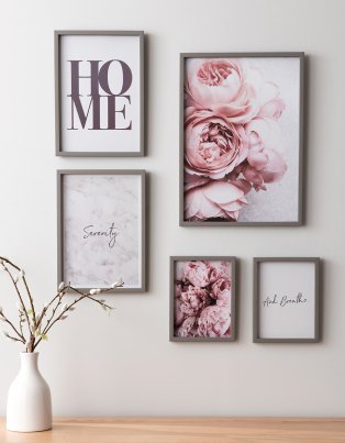 Wall filled with floral prints.