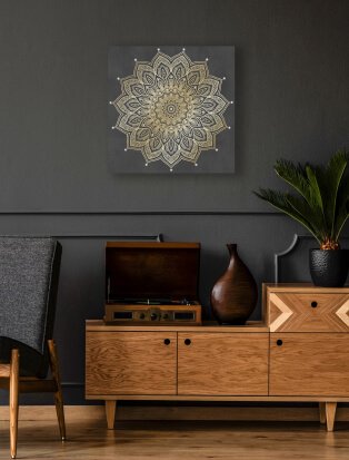 Room with wooden cabinet and sun wall hanging decoration.