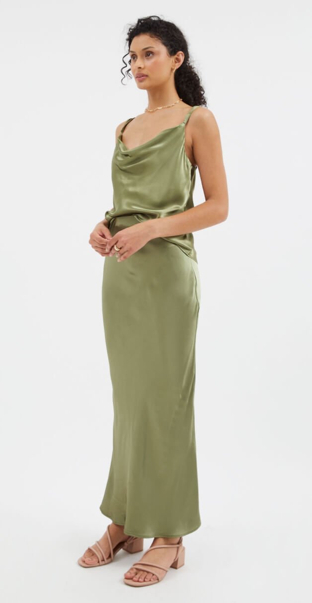 Woman wearing a green silk dress.