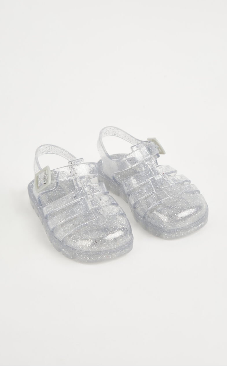 Silver jelly shoes.