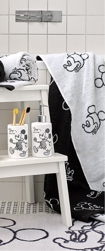 A bathroom with a selection of Mickey Mouse towels and accessories
