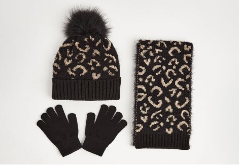 A black leopard print pompom hat, scarf and gloves set.