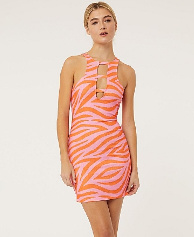 A woman wearing a G21 orange zebra print dress.