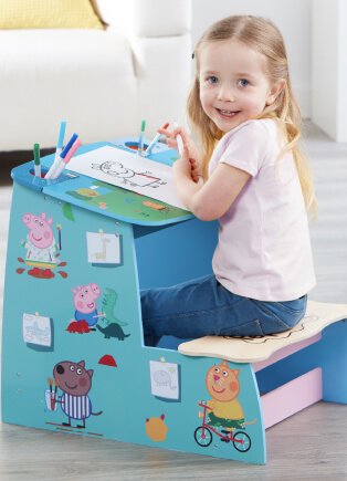 Child sitting at a desk.