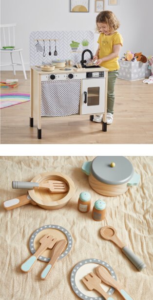 Child playing with kids kitchen, Wooden knife, fork plate set.