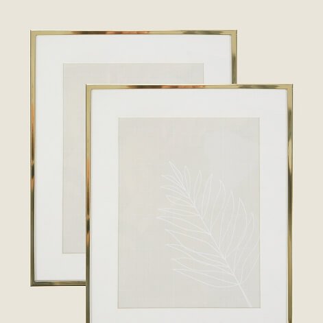 Two gold effect frames