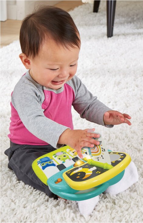 A baby playing with a toy.