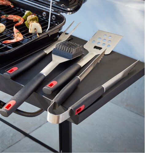 BBQ utensils on a table.