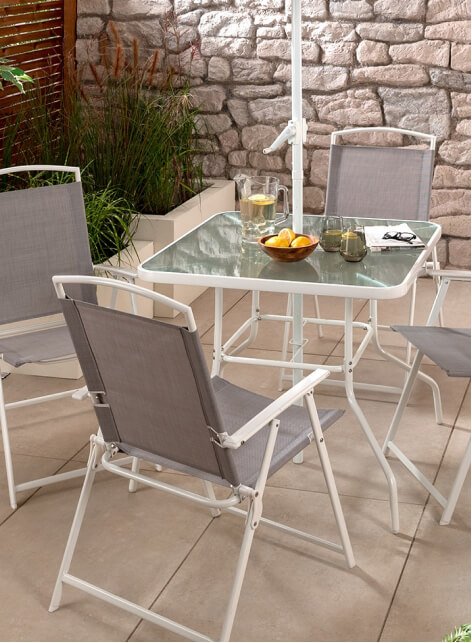 A grey and white garden table and chair set.