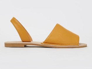 Ochre faux leather slip on sandals.