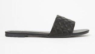 Black quilted mule sandals.