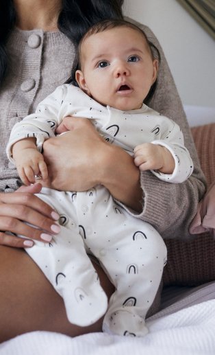 Woman holding baby.